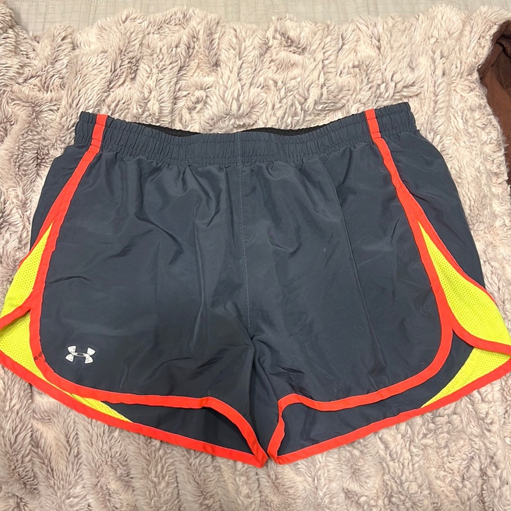 Under Armour workout shorts with liner and drawstrings. Size medium.